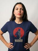 gravisk Warrior organic graphic tee. A lone samurai against a red sun, WARRIOR in cream capitals.