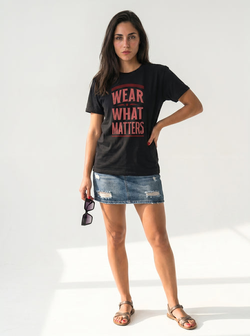 gravisk Wear What Matters organic graphic tee. WEAR WHAT MATTERS in worn red capitals between thin rules.