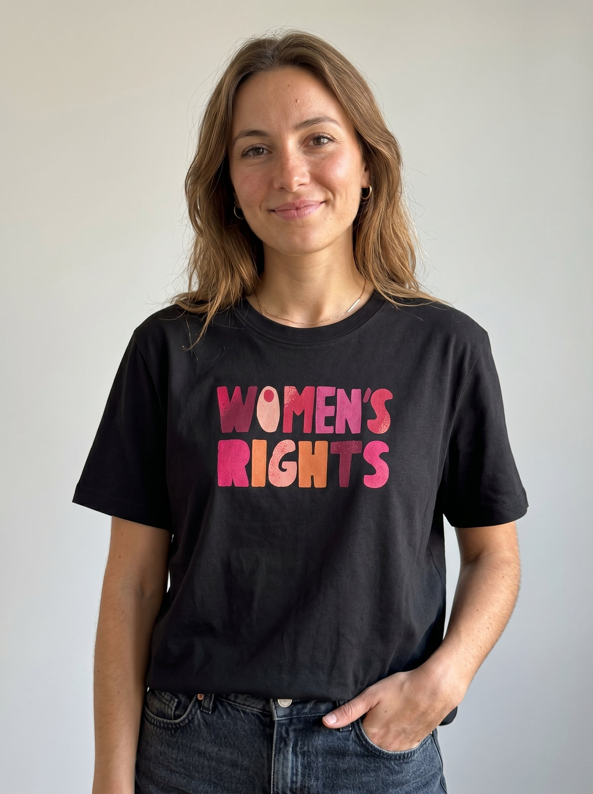 gravisk Women’s Rights. No Compromise. organic graphic tee. WOMEN'S RIGHTS in chunky hand-cut letters in pinks, reds and mustard.