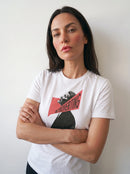 gravisk Introverting organic graphic tee. A tilted profile portrait cut by a red diagonal band reading INTROVERTING.
